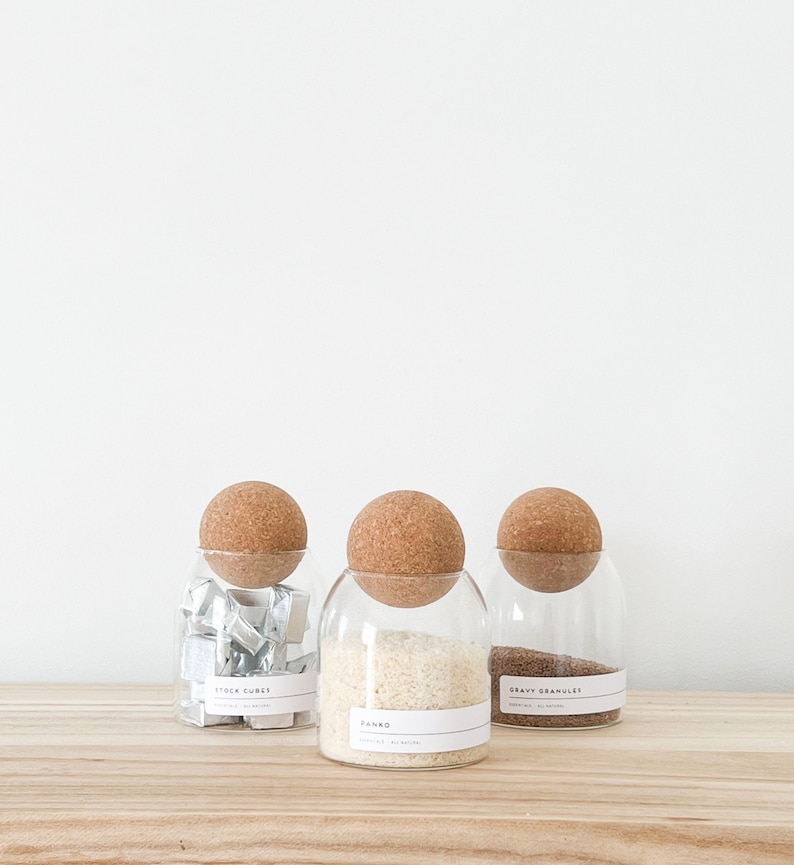 3 glass jar with cork ball lids and wooden tray