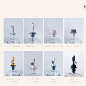 May include: Eight glass bottles with different lid and pourer options. The lids are clear, black, natural wood, and dark wood. The pourers are yellow gold, light gold, silver, and black.
