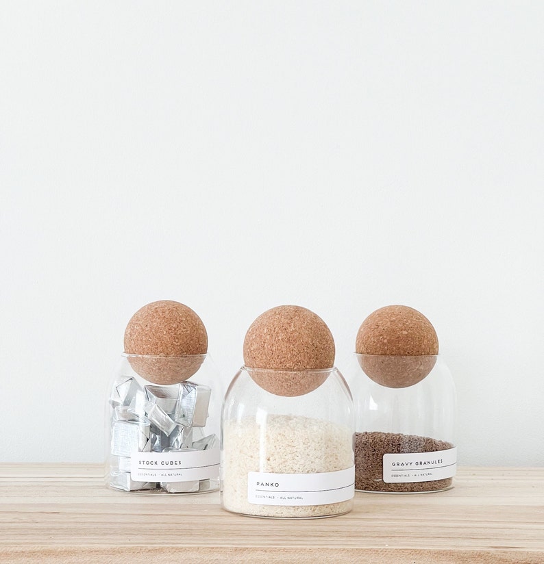 3 glass jar with cork ball lids and wooden tray