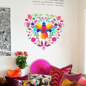 May include: A colorful heart-shaped wall decal with a stylized bird and floral designs in shades of pink, purple, blue, green, yellow, and orange.