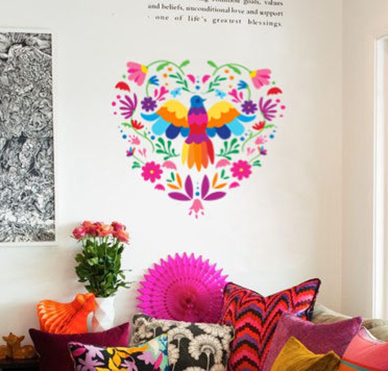 May include: A colorful heart-shaped wall decal with a stylized bird and floral designs in shades of pink, purple, blue, green, yellow, and orange.