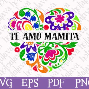 Op de afbeelding: Een kleurrijk hartvormig ontwerp met ingewikkelde bloemmotieven in tinten rood, groen, geel, blauw en paars. De tekst "TE AMO MAMITA" staat in zwarte letters over het midden van het hart.
