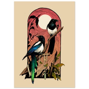 May include: A vertical art print featuring two black and white magpies perched on a branch within an arched frame. One bird holds a small key in its beak, while a crystal pendant hangs from the branch. The background shows a pink sun and foliage.