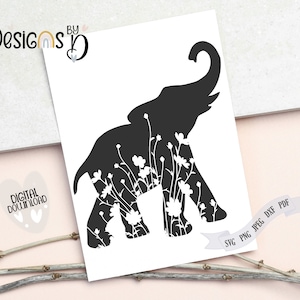 May include: Black silhouette of an elephant with white floral details inside the outline. The elephant is walking to the right. The image is on a white background.