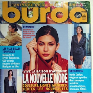 May include: A magazine cover featuring a woman with dark hair and red lipstick. The magazine title is "burda" in large yellow letters. Text includes "La Nouvelle Mode" and "Vive la Saison d'Automne". Other images show fashion trends.
