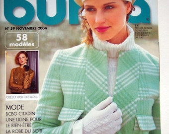 May include: A fashion magazine cover with the title "burda" in teal. The cover features a woman wearing a light green plaid jacket, white gloves, and a cream-colored beret. The text "LES PASTELS ILLUMINENT L'HIVER" is displayed.