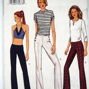 May include: Vogue sewing pattern 7573 featuring three fashion illustrations. The designs include a halter top and flared jeans, a striped top with white pants, and a white top with plaid pants. The pattern size is 6, 8, and 10.