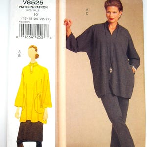 May include: A sewing pattern for The Vogue Woman, V8525, showing a woman in a dark grey outfit with a long top and trousers. The pattern also includes a yellow top and black skirt design. The pattern size is F5.