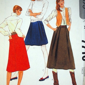 May include: A vintage McCall's sewing pattern with illustrations of women's outfits. The outfits include skirts, blouses, and vests in red, blue, and brown. The pattern text includes "PATTERN/PATRON" and "Tops not included".