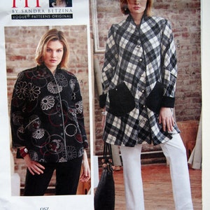 May include: A Vogue Patterns sewing pattern envelope for Today's Fit by Sandra Betzina, featuring two jacket designs: a black jacket with white and red circular floral patterns and a black and white plaid jacket with large patch pockets and buttons.