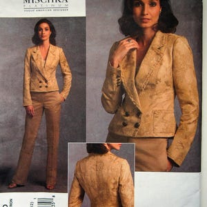 May include: A sewing pattern featuring a woman in a gold-colored suit. The suit includes a double-breasted blazer and matching pants. The pattern is labeled "Badgley Mischka Platinum" and "Vogue American Designer."