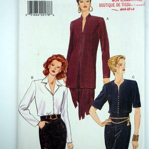 May include: A Very Easy Very Vogue sewing pattern, featuring three different women's fashion designs. The pattern includes a long burgundy coat, a white button-down shirt, and a navy blue short-sleeved top. The pattern size is 14-16-18.