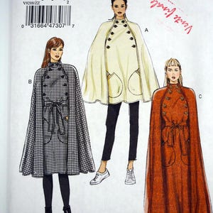 May include: Vogue pattern V9288 showing three cape designs. The capes are in cream, rust, and black and white houndstooth. The pattern includes the text "VERY EASY VOGUE" and size details.