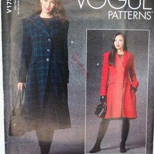 May include: Vogue Patterns V1752 sewing pattern envelope featuring two coat designs. One coat is a long, blue and green plaid wool-style coat with buttons. The second coat is a solid red, knee-length coat with a collar and front button closure.