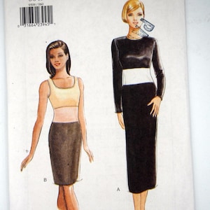 Może przedstawiać: Bardzo łatwy wzór szycia Very Vogue, rozmiary 6-8-10. Wzór zawiera ilustracje dwóch różnych projektów sukienek. Numer wzoru to 9509. Okładka ma białe tło.