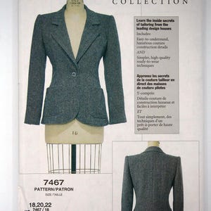 May include: A gray tweed blazer pattern from the Claire Shaeffer's Custom Couture Collection. The pattern includes sizes 18, 20, and 22. The front of the blazer is displayed on a dress form, showcasing its tailored design with a single-button closure and pockets.