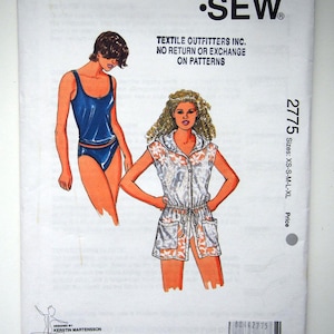 May include: Sewing pattern for two garments: a sleeveless hooded tunic with a drawstring waist and a tank top swimsuit. The pattern is for sizes XS-S-M-L-XL and is from Kwik Sew Pattern Co., Inc.