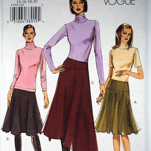 May include: A sewing pattern from Very Easy Vogue featuring three different outfits. The illustrations show a pink long-sleeve turtleneck with a black skirt, a purple long-sleeve turtleneck with a burgundy skirt, and a short-sleeve beige top with a green skirt. The pattern number is V7970.