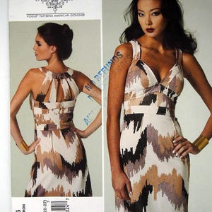 May include: Vogue Patterns American Designer Tracy Reese dress pattern V1286. The dress features a geometric pattern in black, brown, and beige. The pattern includes sizes 14-16-18-20-22. The image shows the dress on a model.