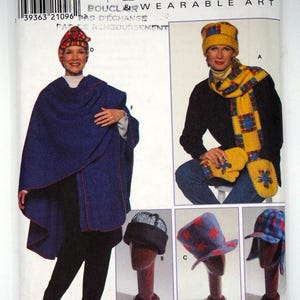 May include: A Simplicity Accessories sewing pattern envelope for wearable art, featuring illustrations of a blue poncho, a yellow plaid scarf and mittens, and various hats including a red star-patterned hat and a blue plaid cap.