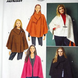 May include: Butterick sewing pattern B5959 for capes and ponchos in sizes Xsm-Sml-Med. The envelope features illustrations and photographs of four different cape designs in orange, brown, white with black grid patterns, pink, and black fabric.