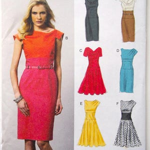 May include: Vogue Patterns Easy options dressmaking pattern. The image shows a woman wearing a two-tone dress. The pattern includes several dress designs in various colors and styles, including a red, yellow, and blue dress. The pattern size is V8872.