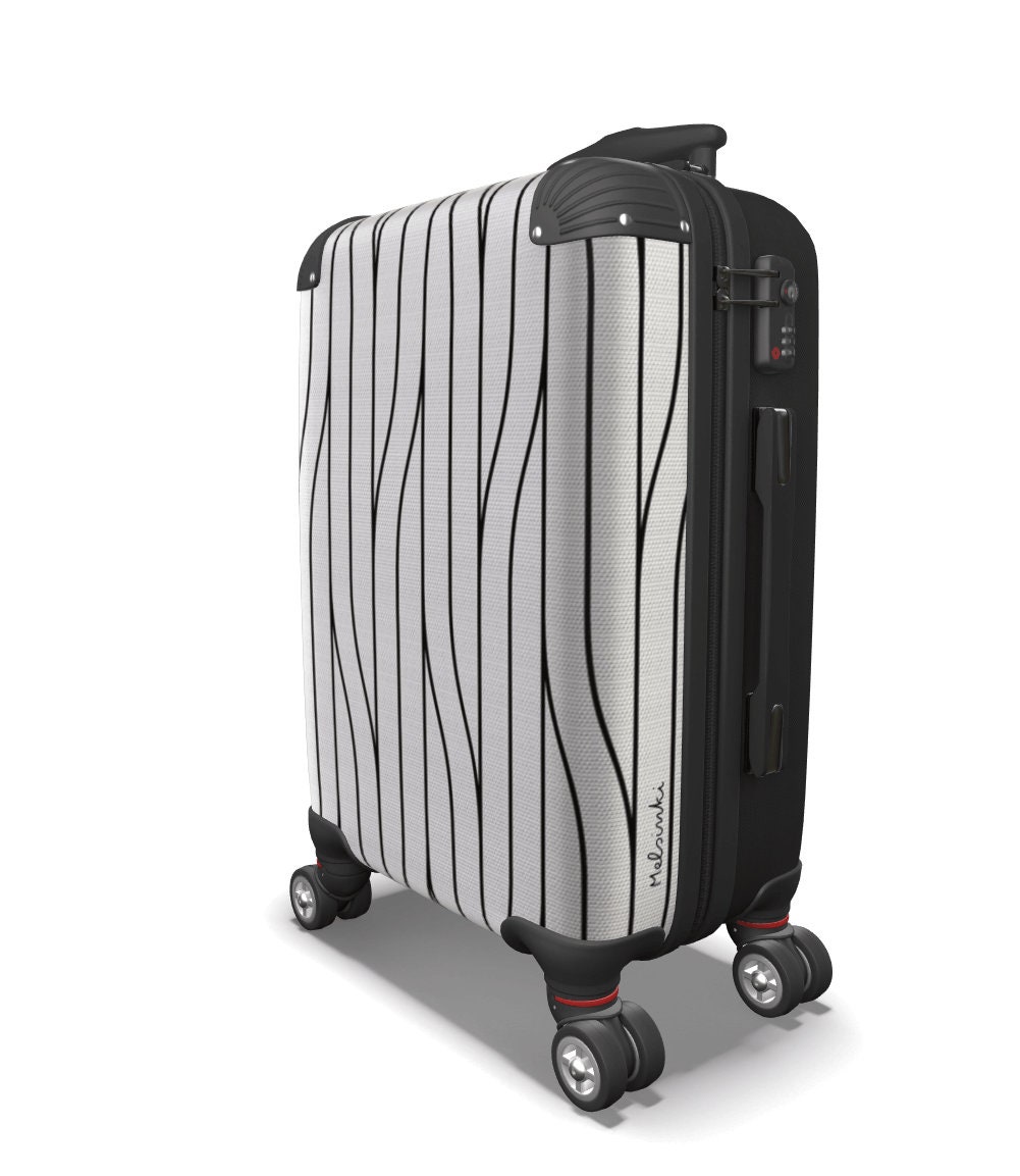 white luggage with brown trim