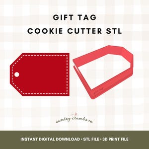 May include: A red gift tag cookie cutter STL file. The image shows a solid red gift tag shape and a red outline of the gift tag. The text "GIFT TAG COOKIE CUTTER STL" is at the top.