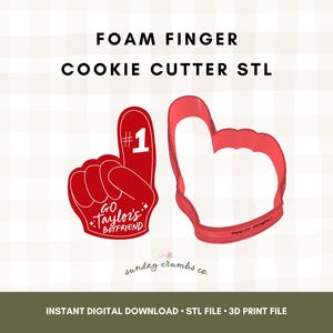 May include: Red foam finger cookie cutter STL file. The design includes a foam finger with the number 1 and the text "GO Taylor's Boyfriend". The image also shows the outline of a foam finger cookie cutter.