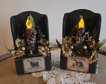 Set of shelf sitting or hanging wood candle holders with pip berry floral arrangement and 5in led candles