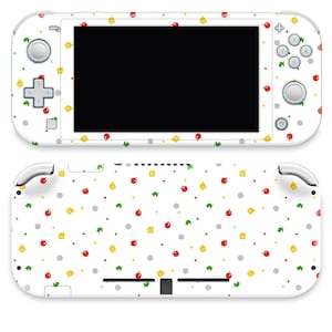 May include: White Nintendo Wii U console skin with a repeating pattern of red apples, green leaves, yellow squares, and gray dots. The skin covers the console and controller, enhancing the device's appearance.