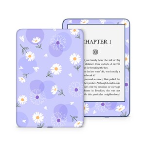 May include: A purple and white floral patterned Kindle Paperwhite case with a white daisy design and the text "CHAPTER 1" on the screen.