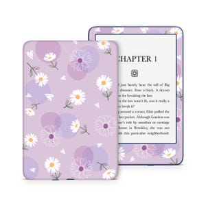 May include: A purple and white floral patterned Kindle Paperwhite e-reader case with the text "CHAPTER 1" on the screen.