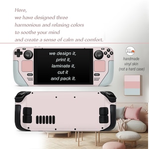 May include: Pink and white vinyl skin for a handheld gaming device. The skin is designed to be a protective layer for the device, and it features a custom design with the text "we design it, print it, laminate it, cut it and pack it." The skin is handmade and is not a hard case.