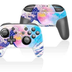 May include: Two game controllers with a colorful design featuring a wave pattern in shades of blue, pink, and yellow. The controllers have black buttons and grips, and are set against a white background.