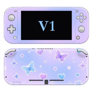 May include: A handheld gaming console with a pastel purple and blue gradient finish. The front features a screen displaying the text V1, while the back is decorated with a pattern of blue and purple butterflies, hearts, and four-pointed stars.