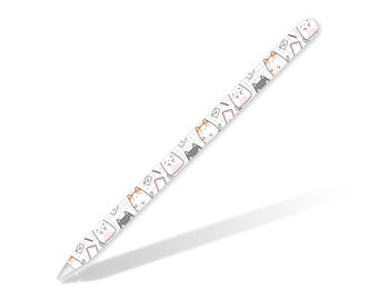 May include: White Apple Pencil skin with a repeating pattern of black and orange cats with envelopes. The cats are drawn in a simple cartoon style.
