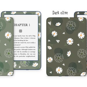 May include: Two Kindle Paperwhite e-reader covers with a daisy and circle pattern. The cover on the left is sage green and the cover on the right is dark olive green. The text "CHAPTER 1" is visible on the e-reader screen.