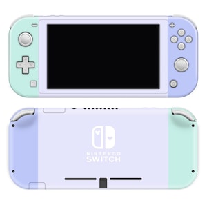May include: A lavender and mint green Nintendo Switch Lite console with a white Nintendo Switch logo and two white hearts. The console is closed and the back of the console is visible.