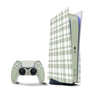 May include: A PlayStation 5 console and controller set. The console and controller are a light green colour with a white and light green plaid pattern. The controller has black buttons and a blue accent.