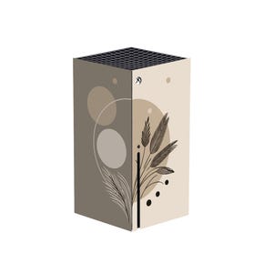 May include: A decorative console skin featuring a split design with a neutral color palette. One side is taupe with circular accents, the other is beige with a botanical illustration. The top has a black grid pattern.
