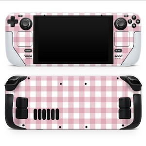 May include: A handheld gaming console skin with a pink and white gingham design. The skin covers the front and back of the device, including the buttons, joysticks, and screen. The Steam logo is visible on the front.