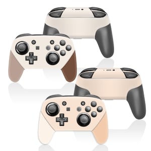 May include: Four wireless game controllers in a studio shot. The controllers have a cream-colored body with gray and brown accents. Each controller has a directional pad, buttons, and joysticks.