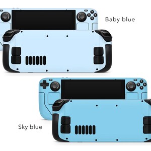 May include: Two Nintendo Switch consoles with different coloured faceplates. The top console has a baby blue faceplate and the bottom console has a sky blue faceplate. Both consoles have black buttons and a black screen.