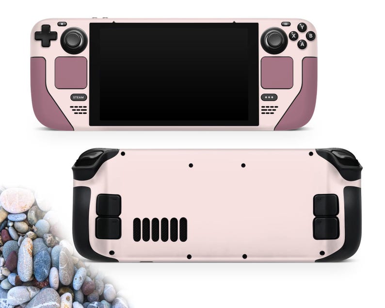 May include: A handheld gaming console in a light pink and mauve color scheme. The front features a black screen, control buttons, and a directional pad. The back has black grips and vents. The console is shown from the front and back.