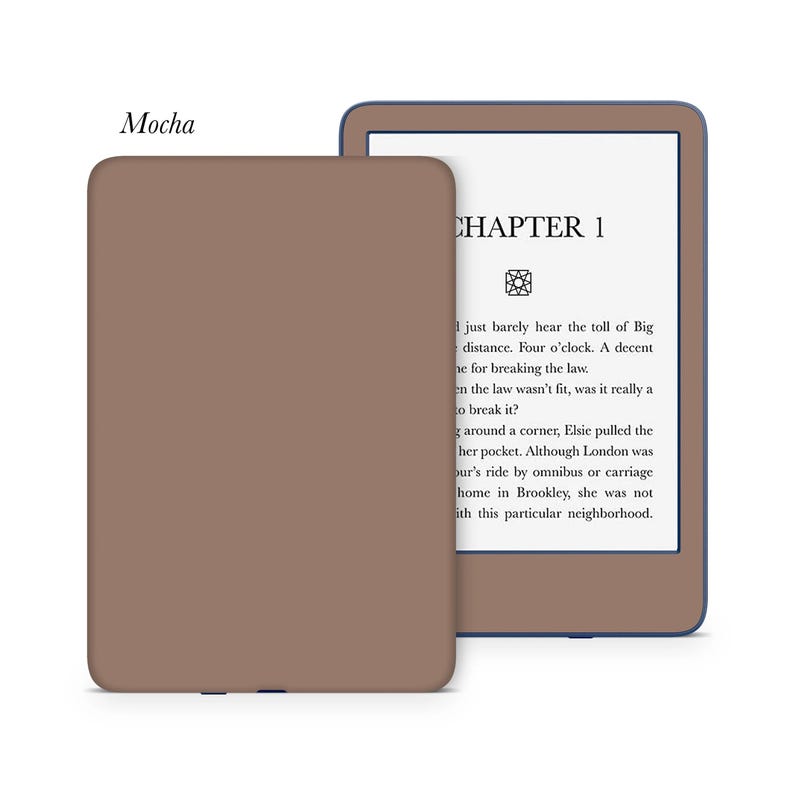 May include: A brown Kindle Paperwhite e-reader with a navy blue border. The screen displays the text "CHAPTER 1" and a short excerpt from a book.