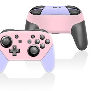 May include: Two pink and light purple game controllers. The controllers have black buttons and gray handles. The controllers are designed for gaming. The controllers are shown on a white background.