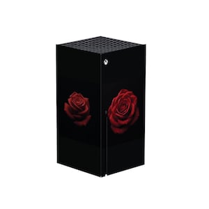 May include: Black gaming console with a red rose design on the front.