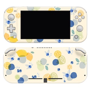 May include: A white Nintendo Switch Lite console skin with a lemon and blueberry pattern. The skin features yellow lemons, blue blueberries, and green leaves on a white background.