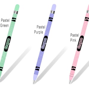 May include: Three Apple Pencil skins with a Crayola crayon design. The skins are pastel mint green, pastel purple, and pastel pink. Each skin has the word "Crayon" printed on it.